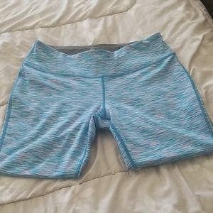 2 pairs of Tek Gear workout crop pants.